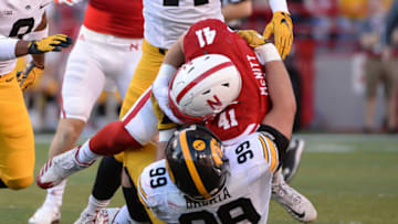 LINCOLN, NE - NOVEMBER 24: Defensive lineman Nathan Bazata #99 of the Iowa Hawkeyes tackles fullback Luke McNitt #41 of the Nebraska Cornhuskers on a fake field goal attempt at Memorial Stadium on November 24, 2017 in Lincoln, Nebraska. (Photo by Steven Branscombe/Getty Images)
