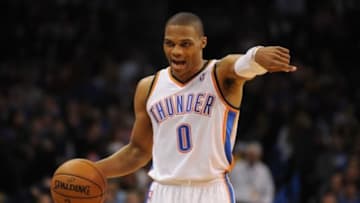 Dec 22, 2013; Oklahoma City, OK, USA; Oklahoma City Thunder point guard Russell Westbrook (0) directs his team in action against the Toronto Raptors during the third quarter at Chesapeake Energy Arena. Mandatory Credit: Mark D. Smith-USA TODAY Sports