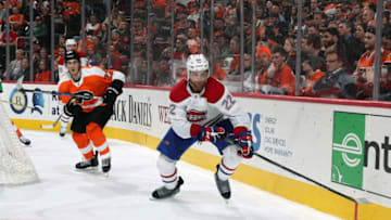 PHILADELPHIA, PA - FEBRUARY 20: Karl Alzner #22 of the Montreal Canadiens skates the puck against Dale Weise #22 of the Philadelphia Flyers on February 20, 2018 at the Wells Fargo Center in Philadelphia, Pennsylvania. (Photo by Len Redkoles/NHLI via Getty Images)