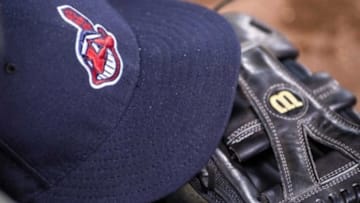 May 16, 2015; Arlington, TX, USA; A view of a Cleveland Indians baseball hat and glove during the game between the Texas Rangers and the Indians at Globe Life Park in Arlington. The Indians defeated the Rangers 10-8. Mandatory Credit: Jerome Miron-USA TODAY Sports