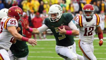 Oct 24, 2015; Waco, TX, USA; Baylor Bears quarterback Jarrett Stidham (3) stiff arms Iowa State Cyclones defensive back Darian Cotton (23) during a game at McLane Stadium. Baylor won 45-27. Mandatory Credit: Ray Carlin-USA TODAY Sports
