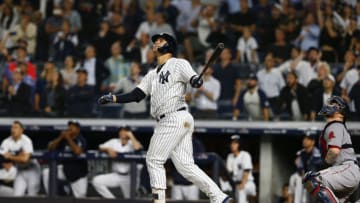 NEW YORK, NEW YORK - OCTOBER 09: Gary Sanchez #24 of the New York Yankees hits a sac fly to score Didi Gregorius #18 against Craig Kimbrel #46 of the Boston Red Sox during the ninth inning in Game Four of the American League Division Series at Yankee Stadium on October 09, 2018 in the Bronx borough of New York City. (Photo by Mike Stobe/Getty Images)