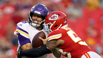 KANSAS CITY, MISSOURI - AUGUST 27: Quarterback Kirk Cousins #8 of the Minnesota Vikings is sacked by inside linebacker Anthony Hitchens #53 of the Kansas City Chiefs during the 1st quarter of the preseason game at Arrowhead Stadium on August 27, 2021 in Kansas City, Missouri. (Photo by Jamie Squire/Getty Images)