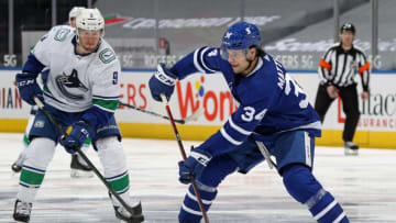 Auston Matthews #34 of the Toronto Maple Leafs makes a pass. (Photo by Claus Andersen/Getty Images)
