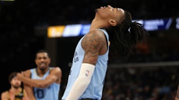 Jan 11, 2022; Memphis, Tennessee, USA; Memphis Grizzles guard Ja Morant (12) reacts after a foul call during the first half against the Golden State Warriors at FedExForum. Mandatory Credit: Petre Thomas-USA TODAY Sports