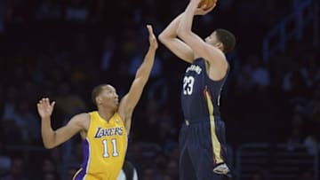 Mar 4, 2014; Los Angeles, CA, USA; New Orleans Pelicans forward Anthony Davis (23) goes up for a shot defended by Los Angeles Lakers guard Wesley Johnson (11) during the first quarter at Staples Center. Mandatory Credit: Kelvin Kuo-USA TODAY Sports