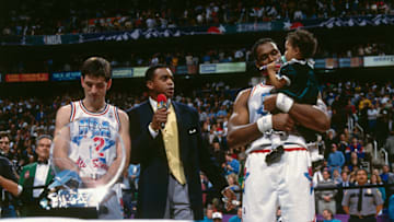 SALT LAKE CITY, UT - FEBRUARY 21: John Stockton #12 and Karl Malone #32 of the Western Conference All-Stars celebrates being named Co-MVP against the Eastern Conference All-Stars during the 1993 All-Star Game on February 21, 1993 at the Delta Center in Salt Lake City, Utah. The West defeated the Eats 135-132 in OT. Copyright 1993 NBAE (Photo by Nathaniel S. Butler/NBAE via Getty Images)