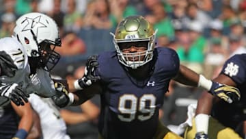 SOUTH BEND, IN - SEPTEMBER 15: Jerry Tillery #99 of the Notre Dame Fighting Irish rushes against Devin Cochran #77 of the Vanderbilt Commodores at Notre Dame Stadium on September 15, 2018 in South Bend, Indiana. Notre Dame defeated Vanderbilt 22-17. (Photo by Jonathan Daniel/Getty Images)