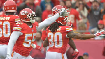 Dec 14, 2014; Kansas City, MO, USA; Kansas City Chiefs linebacker Dee Ford (55) and outside linebacker Justin Houston (50) celebrate after a play during the first half against the Oakland Raiders at Arrowhead Stadium. The Chiefs won 31-13. Mandatory Credit: Denny Medley-USA TODAY Sports