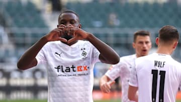 MOENCHENGLADBACH, GERMANY - APRIL 25: Marcus Thuram of Borussia Moenchengladbach celebrates after scoring their side's second goal during the Bundesliga match between Borussia Moenchengladbach and DSC Arminia Bielefeld at Borussia-Park on April 25, 2021 in Moenchengladbach, Germany. Sporting stadiums around Germany remain under strict restrictions due to the Coronavirus Pandemic as Government social distancing laws prohibit fans inside venues resulting in games being played behind closed doors. (Photo by Lars Baron/Getty Images)
