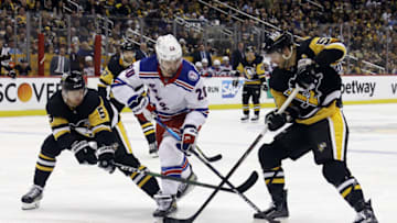 May 9, 2022; Pittsburgh, Pennsylvania, USA; Pittsburgh Penguins defenseman Mike Matheson (5) and Pittsburgh Penguins defenseman Kris Letang (58) defend New York Rangers left wing Chris Kreider (20) during the third period in game four of the first round of the 2022 Stanley Cup Playoffs at PPG Paints Arena. The Penguins won 7-2. Mandatory Credit: Charles LeClaire-USA TODAY Sports