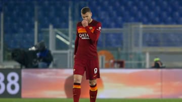 ROME, ITALY - JANUARY 19: Edin Dzeko of AS Roma reacts dejected after Daniele Verde of AC Spezia scored a goal during the Coppa Italia match between AS Roma and AC Spezia at Olimpico Stadium on January 19, 2021 in Rome, Italy. Sporting stadiums around Italy remain under strict restrictions due to the Coronavirus Pandemic as Government social distancing laws prohibit fans inside venues resulting in games being played behind closed doors. (Photo by Giampiero Sposito/Getty Images)