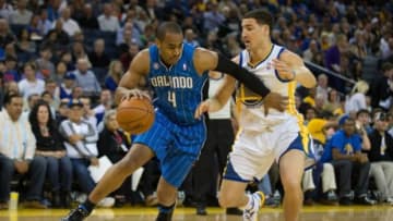 Mar 18, 2014; Oakland, CA, USA; Orlando Magic guard Arron Afflalo (4) drives in against Golden State Warriors guard Klay Thompson (11) during the first quarter at Oracle Arena. Mandatory Credit: Kelley L Cox-USA TODAY Sports