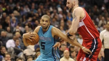 Feb 6, 2016; Charlotte, NC, USA; Charlotte Hornets guard Nicolas Batum (5) drives to the basket past Washington Wizards center Marcin Gortat (13) during the second half at Time Warner Cable Arena. Hornets win 108-104. Mandatory Credit: Sam Sharpe-USA TODAY Sports