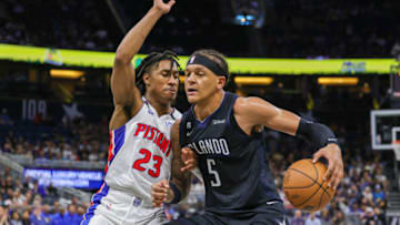 Detroit Pistons guard Jaden Ivey (23) defends Orlando Magic forward Paolo Banchero (5) Credit: Mike Watters-USA TODAY Sports