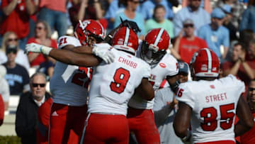 Nov 25, 2016; Chapel Hill, NC, USA; North Carolina State Wolfpack defensive end Bradley Chubb (9) celebrates a fumble recovery with teammates during the first half against the North Carolina Tar Heels at Kenan Memorial Stadium. Mandatory Credit: Rob Kinnan-USA TODAY Sports