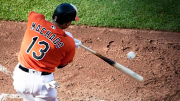 BALTIMORE, MD - JUNE 16: Manny Machado #13 of the Baltimore Orioles singles against the Miami Marlins during the seventh inning at Oriole Park at Camden Yards on June 16, 2018 in Baltimore, Maryland. (Photo by Scott Taetsch/Getty Images)