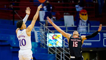 Feb 20, 2021; Lawrence, Kansas, USA; Kansas Jayhawks forward Jalen Wilson (10) shoots over Texas Tech Red Raiders guard Kevin McCullar (15) during the second half at Allen Fieldhouse. Mandatory Credit: Jay Biggerstaff-USA TODAY Sports