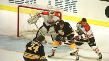 19 Jan 1996: Terry O''Reilly #24 of the Boston Bruin Heroes gets ready to take a shot while teammate Peter McNab #8 fends off Denis Potvin #5 of the NHL Heroes in an attempt to score past goalie John Garrett #31 during the second period of the NHL Heroes