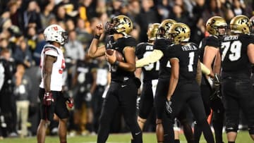 Nov 26, 2016; Boulder, CO, USA; Colorado Buffaloes quarterback Sefo Liufau (13) signals upwards as time expires in the fourth quarter against the Utah Utes at Folsom Field. The Buffaloes defeated the Utes 27-22. Mandatory Credit: Ron Chenoy-USA TODAY Sports