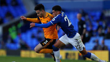 LIVERPOOL, ENGLAND - MAY 19: Rayan Ait-Nouri of Wolverhampton Wanderers battles for possession with Ben Godfrey of Everton during the Premier League match between Everton and Wolverhampton Wanderers at Goodison Park on May 19, 2021 in Liverpool, England. A limited number of fans will be allowed into Premier League stadiums as Coronavirus restrictions begin to ease in the UK. (Photo by Peter Byrne - Pool/Getty Images)