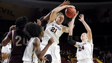 Mar 23, 2015; Tempe, AZ, USA; Arizona State Sun Devils forward Sophie Brunner (21) and forward Kelsey Moos (24) go after the rebound during the first half against the UALR Trojans in the second round of the women