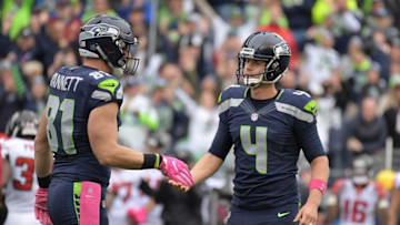 Oct 16, 2016; Seattle, WA, USA; Seattle Seahawks placekicker Steven Hauschka (4) celebrates with tight ened Nick Vannet (81) after kicking a 54 yard goal with 2:02 to play for the winning points against the Atlanta Falcons during a NFL football game at CenturyLink Field. The Seahawks defeated the Falcons 26-24. Mandatory Credit: Kirby Lee-USA TODAY Sports