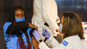 DETROIT, MI - APRIL 06: A group of teenagers serving as 'Covid-19 Student Ambassadors' joined Governor Gretchen Whitmer to receive a dose of the Pfizer Covid vaccine at Ford Field during an event to promote and encourage Michigan residents to go and get their vaccines on April 6, 2021 in Detroit, Michigan. As the US reaches a milestone in vaccinations, a surge of new Covid-19 cases has swept through the US with Michigan seeing the highest numbers of new cases. (Photo by Matthew Hatcher/Getty Images)