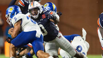 Auburn football linebacker Owen Pappoe (0) tackles San Jose State Spartans running back Kairee Robinson (32) as Auburn Tigers take on San Jose State Spartans at Jordan-Hare Stadium in Auburn, Ala., on Saturday, Sept. 10, 2022.
