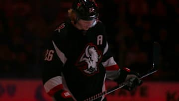 BUFFALO, NEW YORK - JANUARY 07: Rasmus Dahlin #26 of the Buffalo Sabres stands during player introductions before an NHL hockey game against the Minnesota Wild at KeyBank Center on January 07, 2023 in Buffalo, New York. (Photo by Joshua Bessex/Getty Images)