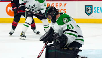 Mar 24, 2022; Raleigh, North Carolina, USA; Dallas Stars goaltender Scott Wedgewood (41) makes a save against the Carolina Hurricanes during the first period at PNC Arena. Mandatory Credit: James Guillory-USA TODAY Sports