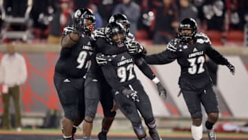 LOUISVILLE, KY - NOVEMBER 12: Devonte Fields #92 of the Louisville Cardinalscelebrates with teammates after a sack during the game against the Wake Forest Deamon Deacons at Papa John's Cardinal Stadium on November 12, 2016 in Louisville, Kentucky. (Photo by Andy Lyons/Getty Images)