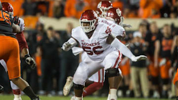 Nov 27, 2021; Stillwater, Oklahoma, USA; Oklahoma Sooners offensive lineman Chris Murray (56) blocks during the first quarter against the Oklahoma State Cowboys at Boone Pickens Stadium. Oklahoma State Cowboys won 37-33. Mandatory Credit: Brett Rojo-USA TODAY Sports