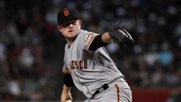 PHOENIX, ARIZONA - AUGUST 17: Logan Webb #62 of the San Francisco Giants delivers a first inning pitch against the Arizona Diamondbacks at Chase Field on August 17, 2019 in Phoenix, Arizona. Webb is playing in his first MLB game. (Photo by Norm Hall/Getty Images)