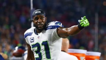 Dec 21, 2014; Glendale, AZ, USA; Seattle Seahawks safety Kam Chancellor (31) reacts against the Arizona Cardinals at University of Phoenix Stadium. The Seahawks defeated the Cardinals 35-6. Mandatory Credit: Mark J. Rebilas-USA TODAY Sports