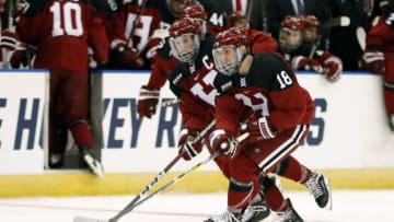 MANCHESTER, NH - MARCH 29: Harvard Crimson defenseman Adam Fox (18) carries the puck during a Northeast Regional semi-final between the UMASS Minutemen and the Harvard Crimson on March 29, 2019, at SNHU Arena in Manchester, NH. (Photo by Fred Kfoury III/Icon Sportswire via Getty Images)