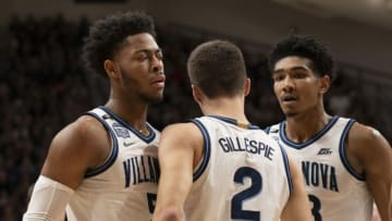 VILLANOVA, PA - DECEMBER 30: Justin Moore #5, Collin Gillespie #2, and Jermaine Samuels #23 of the Villanova Wildcats react against the Xavier Musketeers in the first half at Finneran Pavilion on December 30, 2019 in Villanova, Pennsylvania. The Villanova Wildcats defeated the Xavier Musketeers 68-62. (Photo by Mitchell Leff/Getty Images)