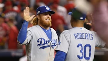 Oct 7, 2016; Washington, DC, USA;Los Angeles Dodgers third baseman Justin Turner (10) celebrates with manager Dave Roberts (30) after defeating the Washington Nationals during game one of the 2016 NLDS playoff baseball series at Nationals Park. The Dodgers won 4-3. Mandatory Credit: Geoff Burke-USA TODAY Sports