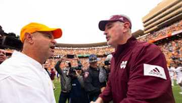 KNOXVILLE, TN - OCTOBER 12: Head coach Jeremy Pruitt of the Tennessee Volunteers shakes hands with head coach Joe Moorhead of the Mississippi State Bulldogs following a game at Neyland Stadium on October 12, 2019 in Knoxville, Tennessee. (Photo by Carmen Mandato/Getty Images)