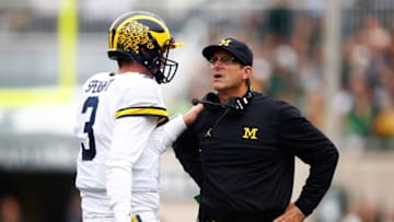 EAST LANSING, MI - OCTOBER 29: Head coach Jim Harbaugh of the Michigan State Spartans talks with Wilton Speight #3 while playing the Michigan State Spartans at Spartan Stadium on October 29, 2016 in East Lansing, Michigan. (Photo by Gregory Shamus/Getty Images)