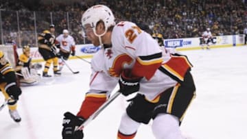 Mar 1, 2016; Boston, MA, USA; Calgary Flames defenseman Dougie Hamilton (27) battles for the puck during the second period against the Boston Bruins at TD Garden. Mandatory Credit: Bob DeChiara-USA TODAY Sports