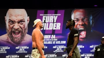 Boxers Deontay Wilder (R) and Tyson Fury (L) attend a press conference on June 15, 2021, in Los Angeles, California to announce their third WBC heavyweight championship fight scheduled for July 24 in Las Vegas. (Photo by FREDERIC J. BROWN / AFP) (Photo by FREDERIC J. BROWN/AFP via Getty Images)