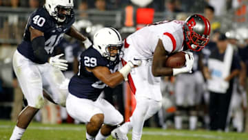 STATE COLLEGE, PA - SEPTEMBER 19: Carlton Agudosi #13 of the Rutgers Scarlet Knights makes a catch and is tackled by John Reid #29 of the Penn State Nittany Lions in the second half during the game on September 19, 2015 at Beaver Stadium in State College, Pennsylvania. (Photo by Justin K. Aller/Getty Images)