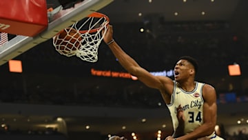 Giannis Antetokounmpo #34 of the Milwaukee Bucks dunks over Julius Randle #30 of the New York Knicks during the first half at Fiserv Forum on December 02, 2019 in Milwaukee, Wisconsin. NOTE TO USER: User expressly acknowledges and agrees that, by downloading and or using this photograph, User is consenting to the terms and conditions of the Getty Images License Agreement. (Photo by Stacy Revere/Getty Images)