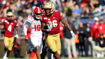 CHESTNUT HILL, MASSACHUSETTS - OCTOBER 19: David Bailey #26 of the Boston College Eagles runs the ball in for a touchdown during the first half of the game between the Boston College Eagles and the North Carolina State Wolfpack at Alumni Stadium on October 19, 2019 in Chestnut Hill, Massachusetts. (Photo by Maddie Meyer/Getty Images)
