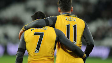 STRATFORD, ENGLAND - DECEMBER 03: (L-R) Alexis Sanchez and Mesut Ozil of Arsenal during the Premier League match between West Ham United and Arsenal at London Stadium on December 3, 2016 in Stratford, England. (Photo by Stuart MacFarlane/Arsenal FC via Getty Images)