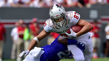 RALEIGH, NC - SEPTEMBER 08: DeAndre Applin #24 of the Georgia State Panthers tackles Thayer Thomas #87 of the North Carolina State Wolfpack during their game at Carter-Finley Stadium on September 8, 2018 in Raleigh, North Carolina. (Photo by Grant Halverson/Getty Images)