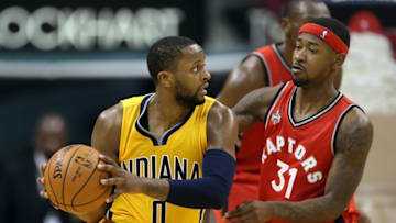 Dec 14, 2015; Indianapolis, IN, USA; Indiana Pacers guard C.J. Miles (0) is guarded by Toronto Raptors guard Terrence Ross (31) at Bankers Life Fieldhouse. Indiana defeats Toronto 106-90. Mandatory Credit: Brian Spurlock-USA TODAY Sports