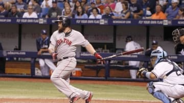 Jul 26, 2014; St. Petersburg, FL, USA; Boston Red Sox left fielder Jonny Gomes (5) singled during the sixth inning against the Tampa Bay Rays at Tropicana Field. Mandatory Credit: Kim Klement-USA TODAY Sports