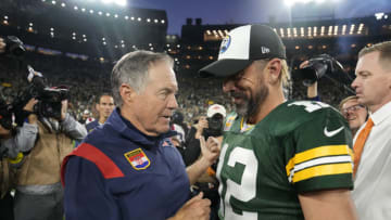 GREEN BAY, WISCONSIN - OCTOBER 02: Head coach Bill Belichick of the New England Patriots and Aaron Rodgers #12 of the Green Bay Packers talk after Green Bay's 27-24 win in overtime at Lambeau Field on October 02, 2022 in Green Bay, Wisconsin. (Photo by Patrick McDermott/Getty Images)